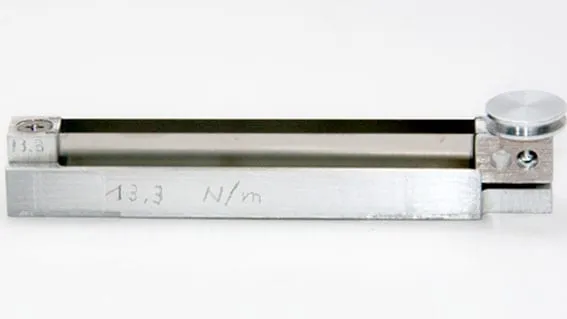 A longer, more compliant SpringTable engraved 13.3 N/m, showing how the table lengthens as the spring constant drops.