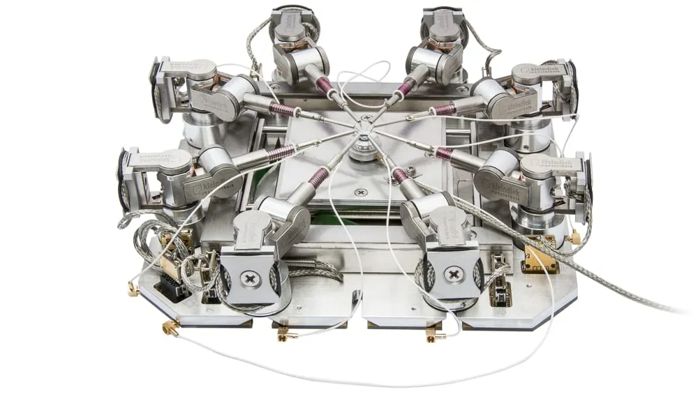 The ProbeWorkstation+ — multiple MM3A-EM micromanipulators arranged around a central sample on a long-range substage.